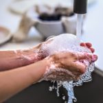 Canva – Person Washing His Hand